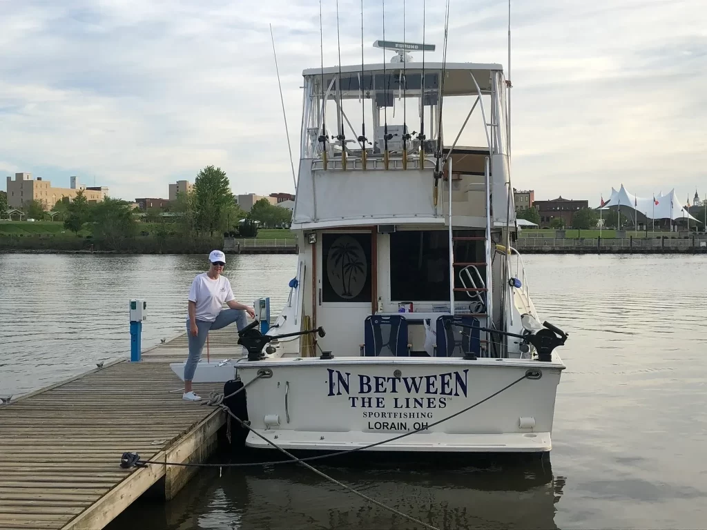 First Mate Sharon showing off this Trophy Fishing Charter Viking Sport Cruiser Fishing Boat at the dock on the Black River, Port of Lorain at Genes Marine