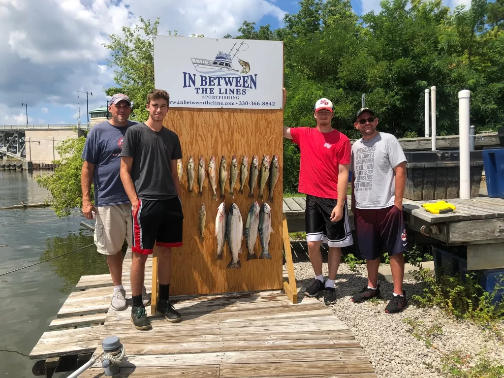 Bill, his brother Brian and sons Dylan and William showing off their catch after Charter Fishing for Walleye on Lake Erie out of Port Lorain Ohio