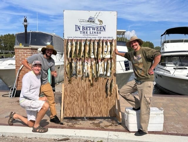 Ken and his sons William and Sam with their Limit of Lake Erie Walleye - Charter Fishing at it's finest out of Grand River Ohio on this 35' Viking Fishing Boat